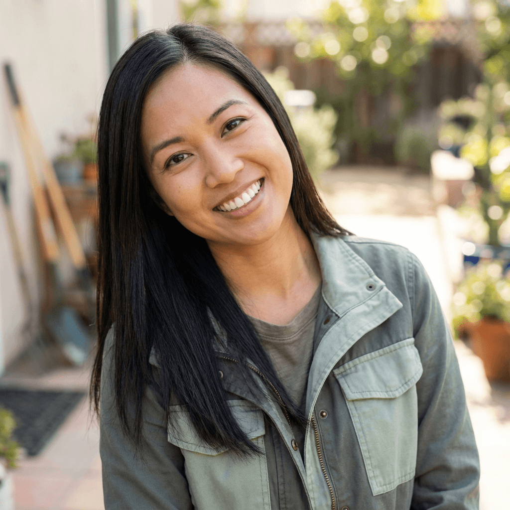 Arevalo Life Coach founder smiling in a bright modern office space